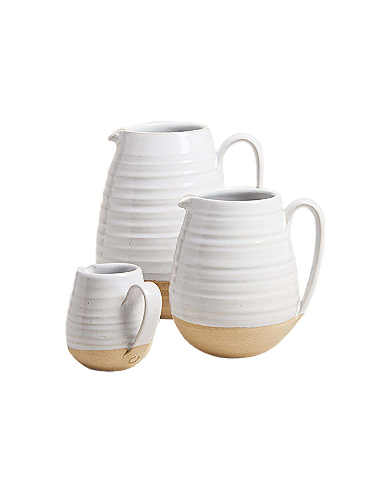 White and beige ceramic farmhouse pitcher with curved handle and spout