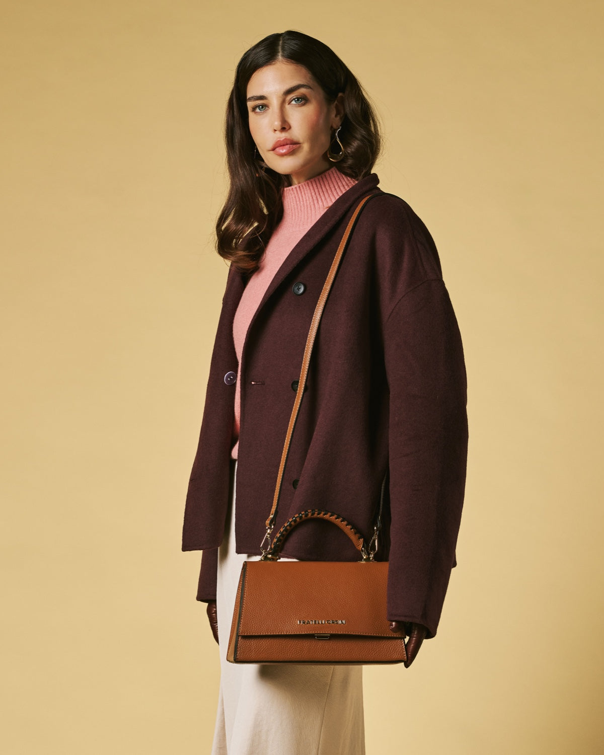 Cognac calf leather crossbody bag with flap, gold hardware, and braided chain strap