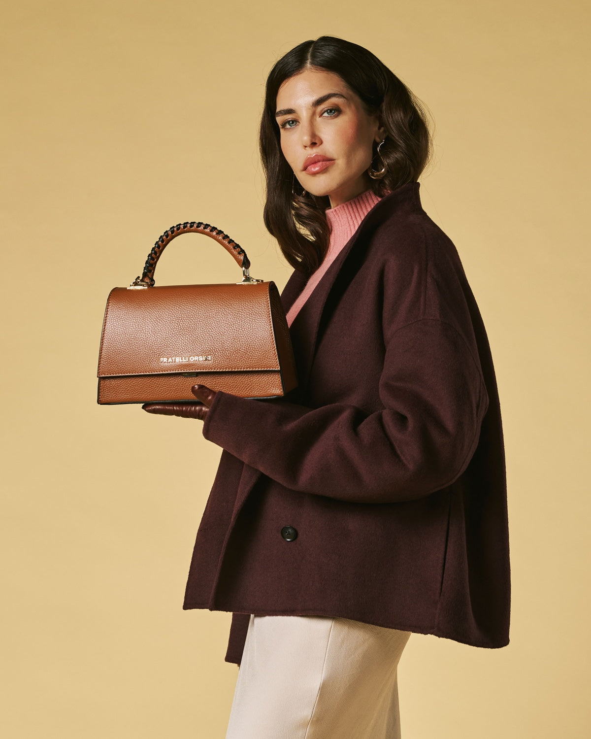 Cognac leather crossbody mini bag with flap and braided top handle, gold hardware