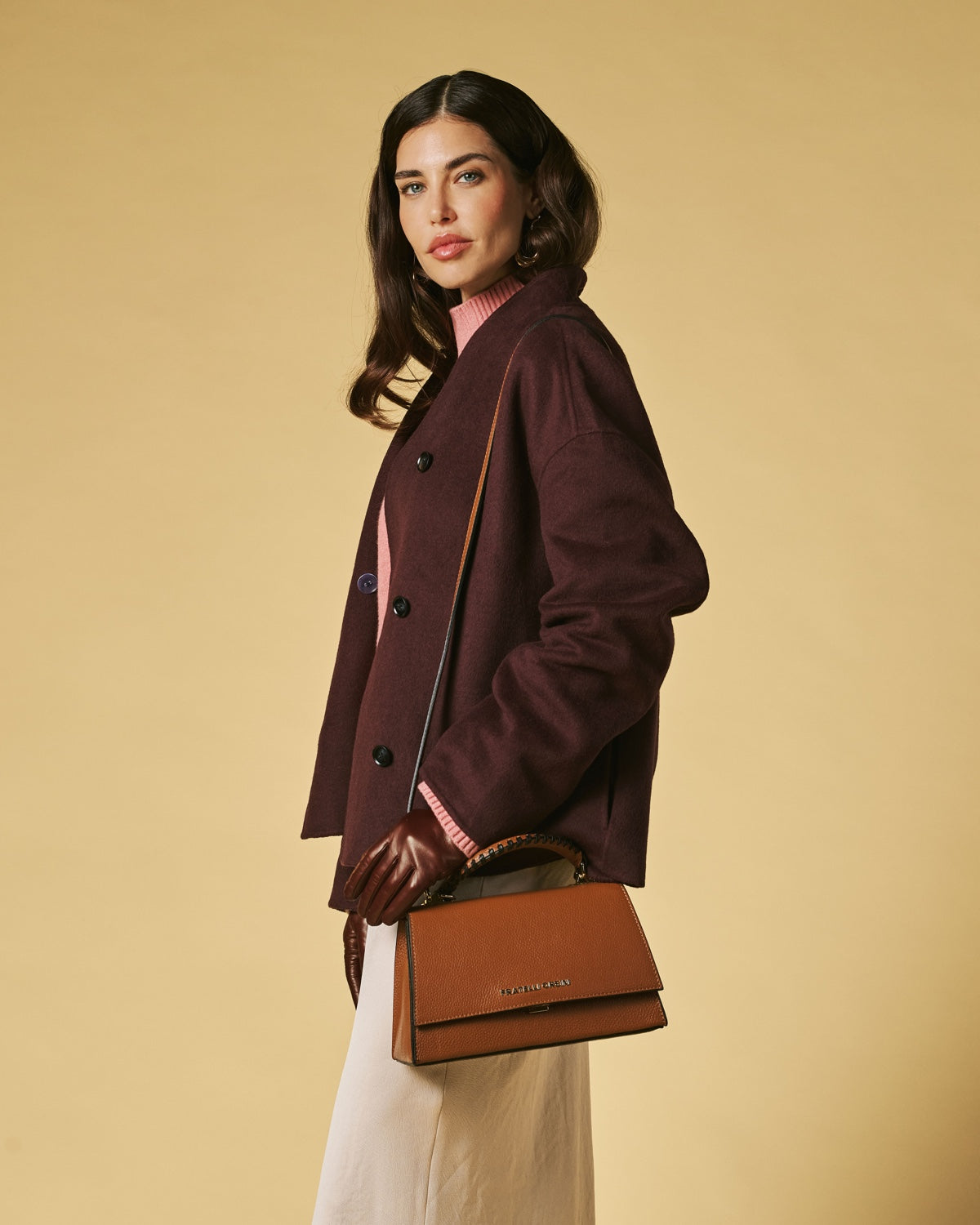 Cognac calf leather crossbody bag with flap, gold hardware, and braided chain handle