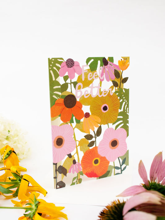Floral laser-cut greeting card with layered flowers and “Feel Better” yellow script