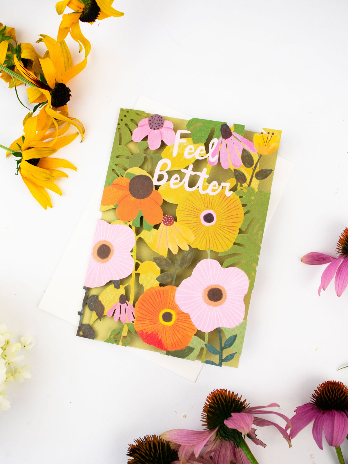Floral laser-cut greeting card with “Feel Better” text and colorful flower cutouts