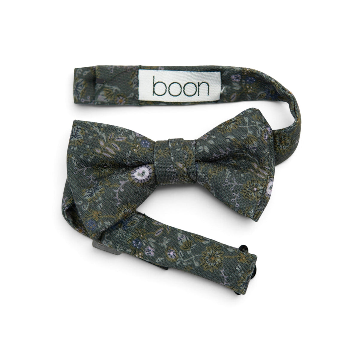 Dark green boys bow tie with floral and leaf pattern; visible branding tag "boon"