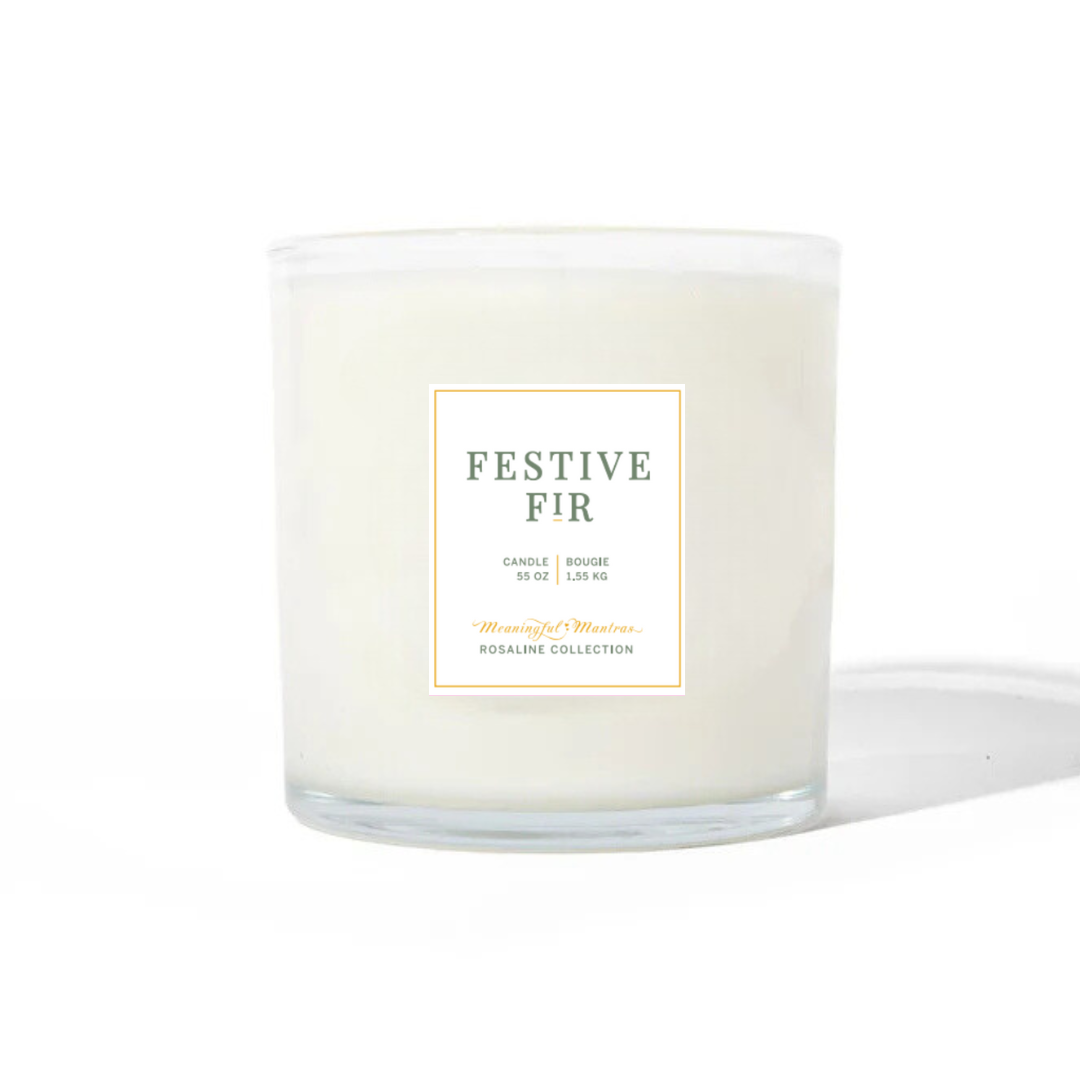 Festive Fir natural candle in a clear glass jar with a front label