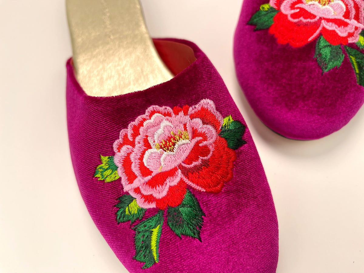 Fuchsia velvet mule slippers with peony floral embroidery on the front, close-up