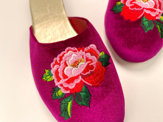 Fuchsia velvet mule slippers with peony floral embroidery on the front, close-up
