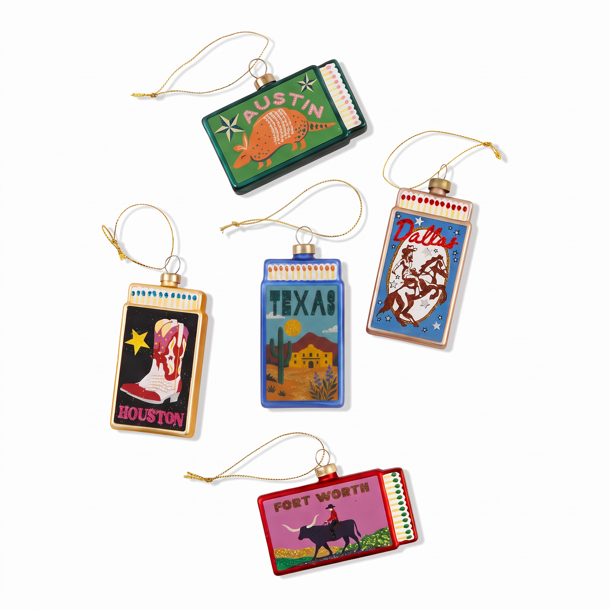 Assorted Texas city matchbook ornaments with colorful illustrated scenes and gold hanging loops