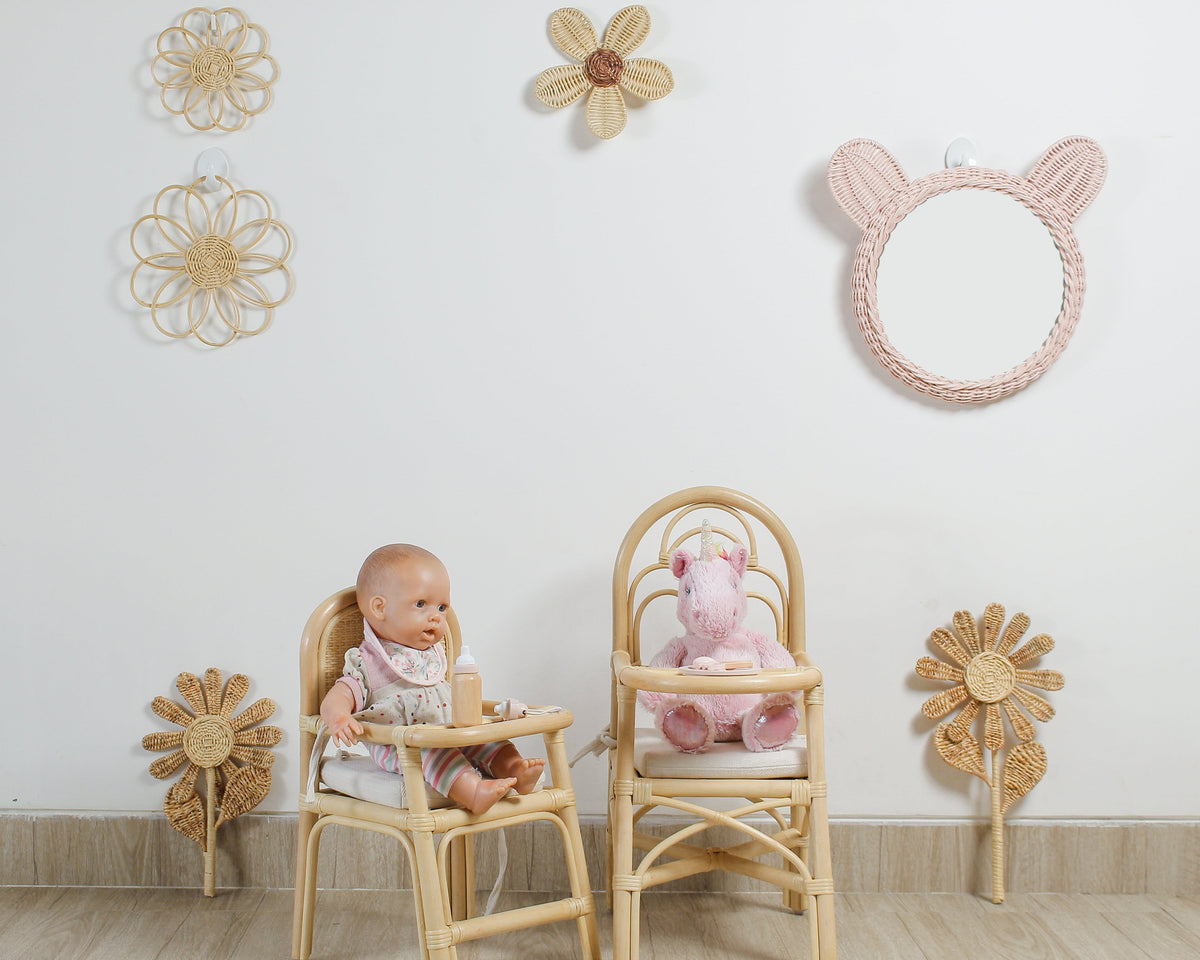 Natural rattan flower wall decorations styled in a nursery