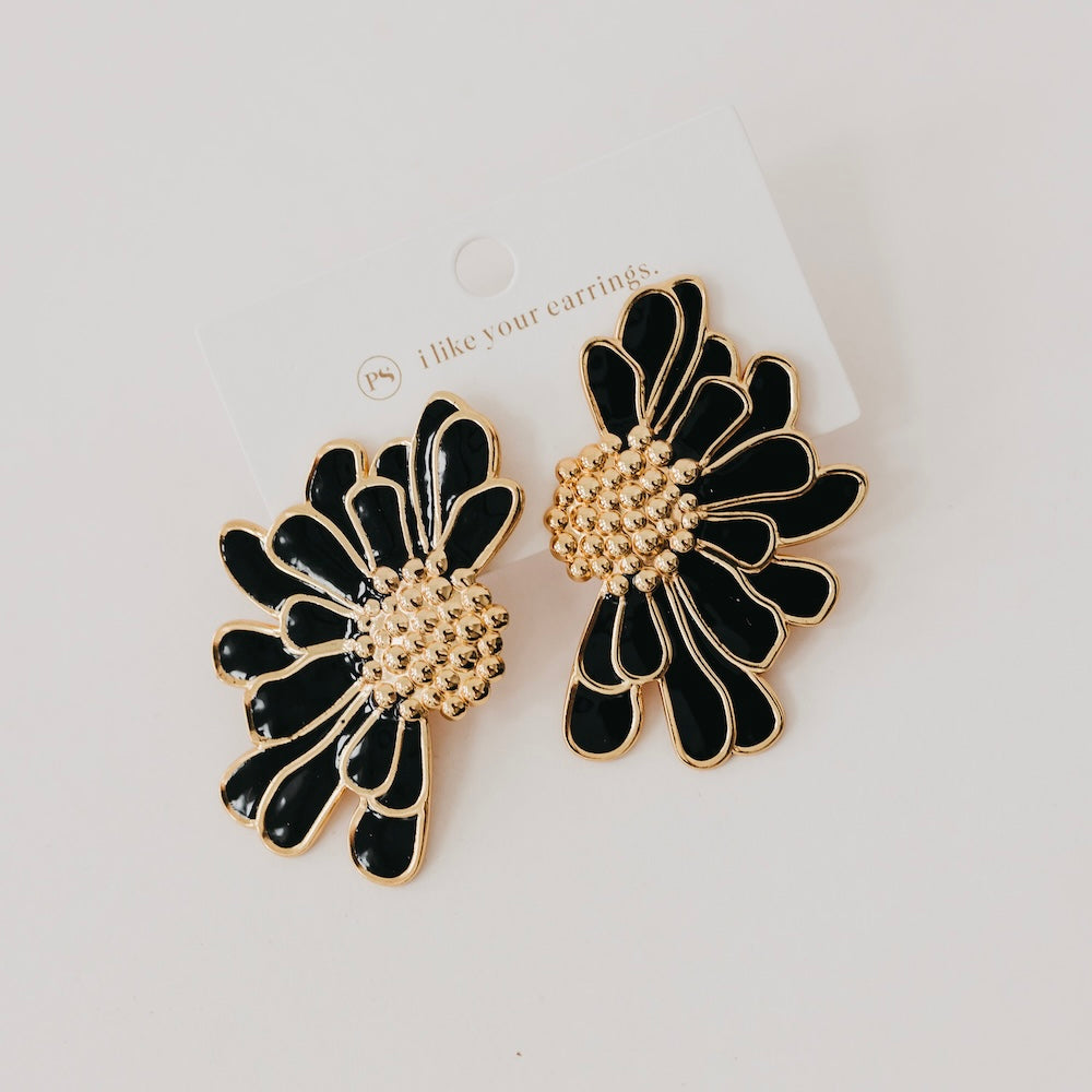 Black enamel flower stud earrings with gold outlines and beaded centers
