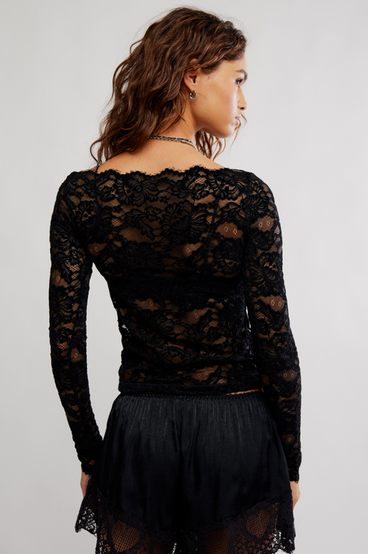 Black lace crop top, back view, long sleeves with scalloped hem