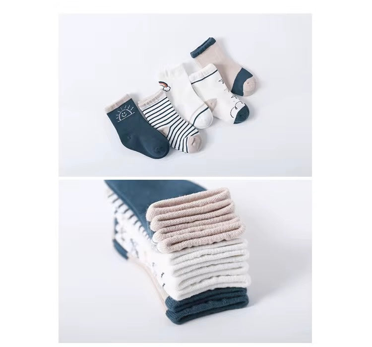 Toddler socks set showing multiple pairs: striped, sun print, and outlined icons