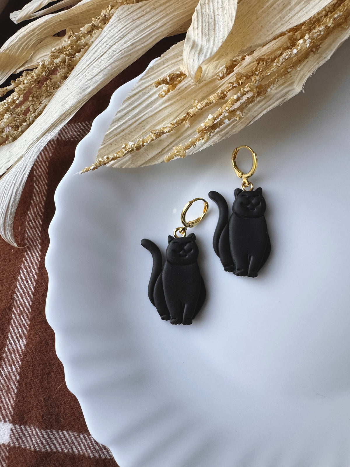 Black cat drop earrings with gold hoop hooks, black enamel cat shapes