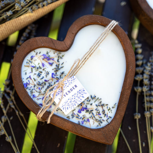 Heart-shaped wood dough bowl candle with white soy wax, lavender sprigs, and twine tag