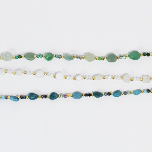 Beaded necklace set with green, white, and blue gemstone-style beads and gold-tone accents.