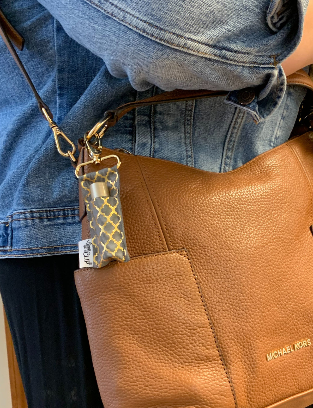 Brown leather bag with gold-tone LippyClip® lip balm holder key clip