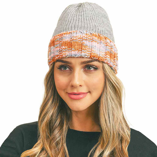 Gray knit fleece beanie with multicolor orange band and folded cuff