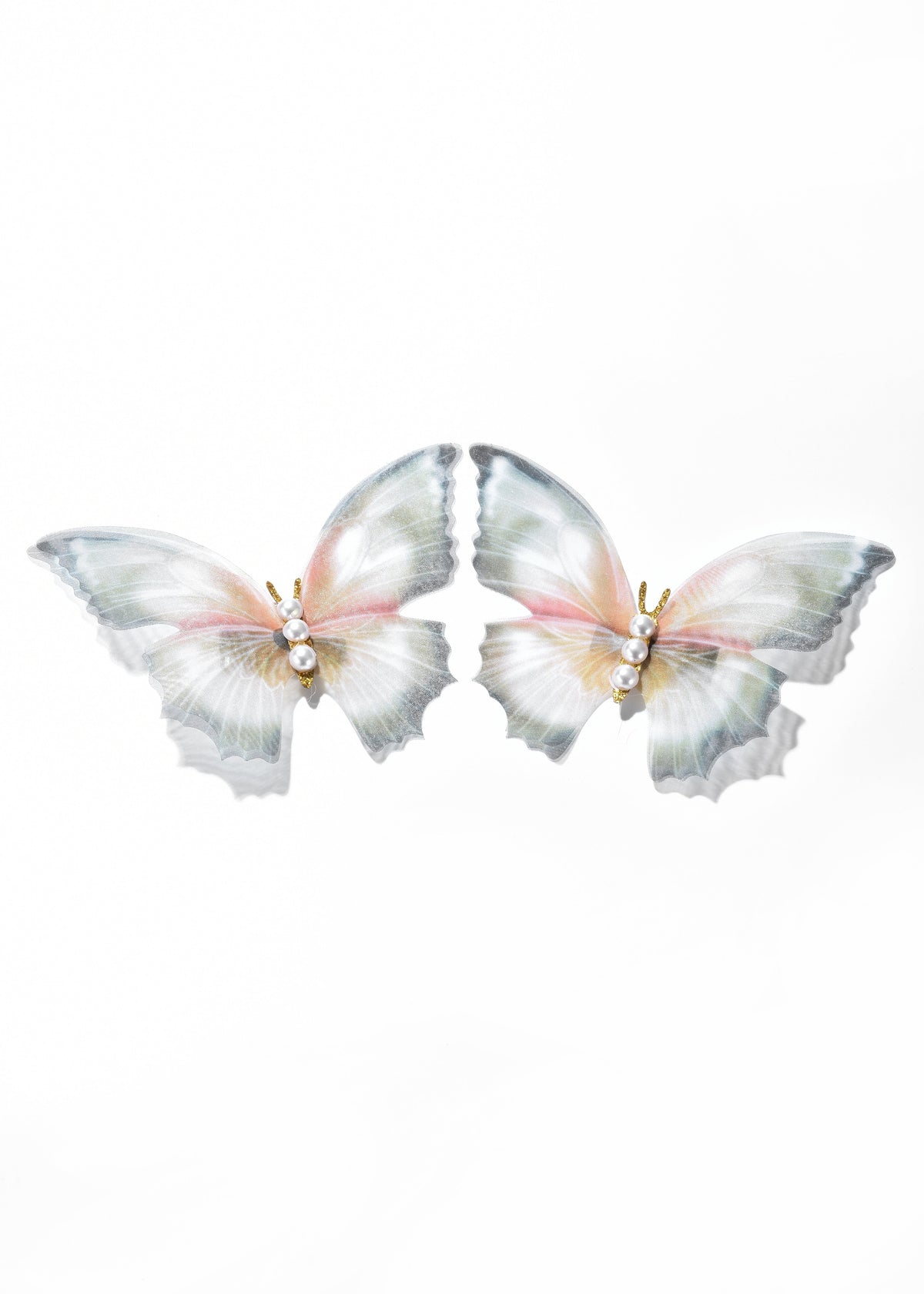 Butterfly barrette with pearly translucent wings and jeweled body