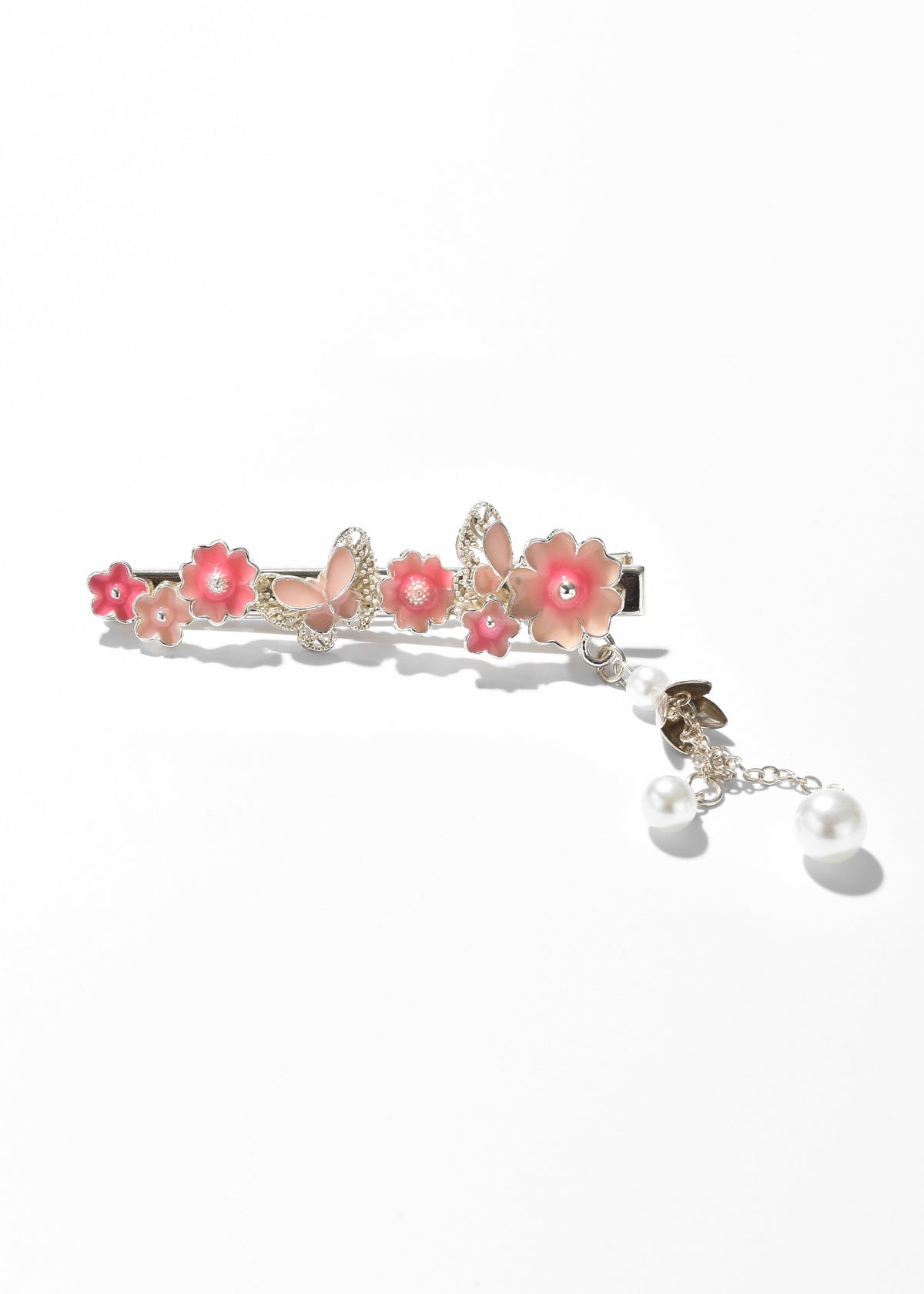 Floral hair clip with pink flowers, gold-tone details, and dangling pearl charms
