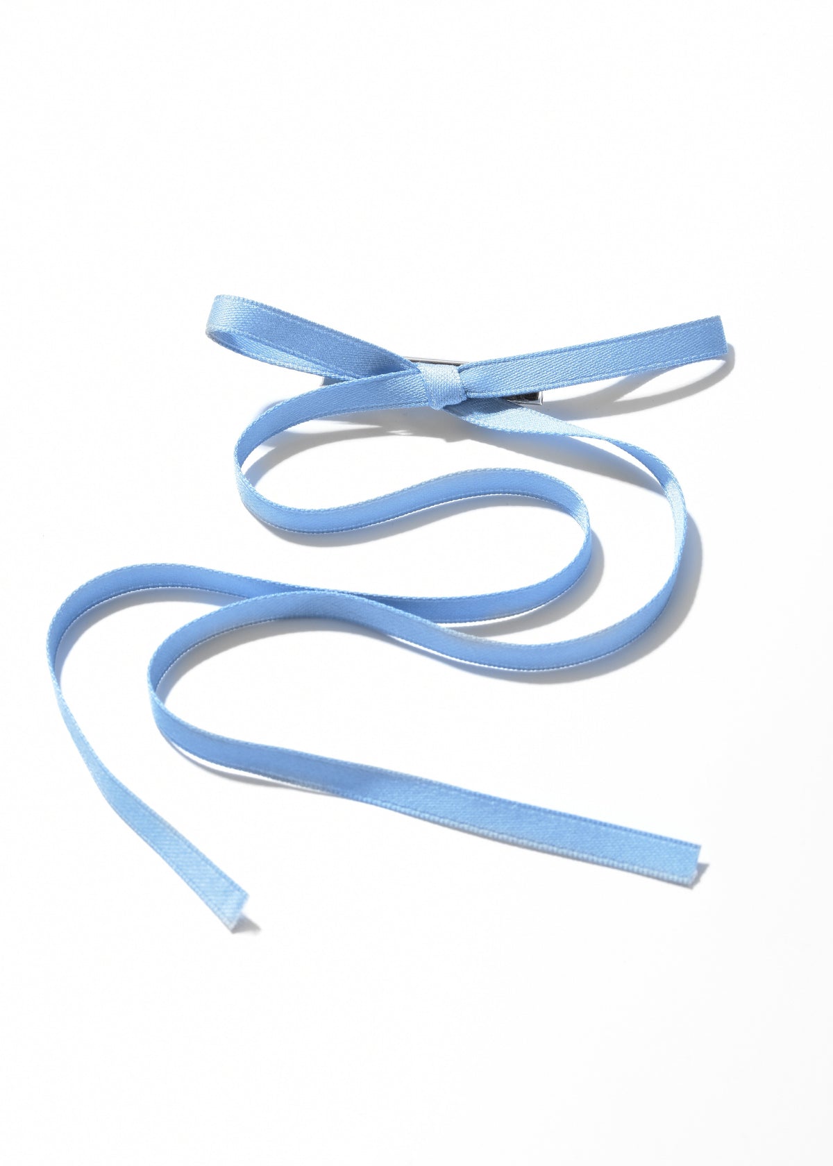 Blue ribbon hair clip with a bow and long flowing tails