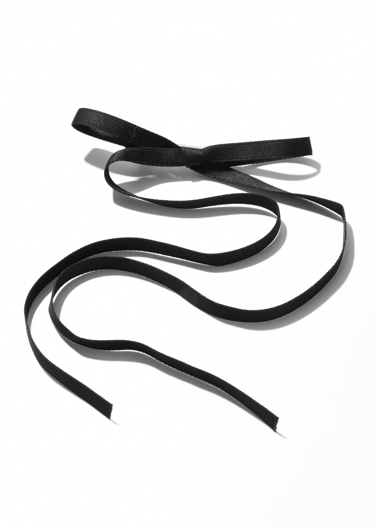 Black ribbon hair clip with a bow and long flowing tails
