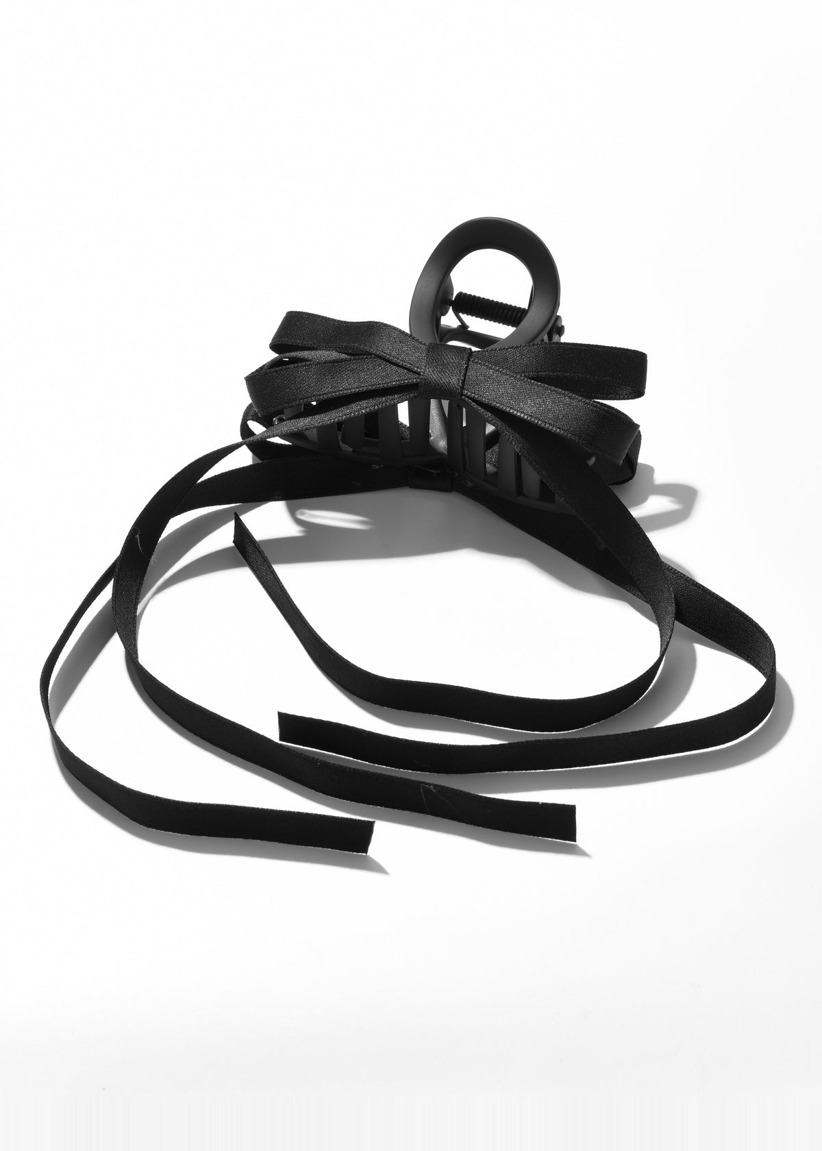 Black hair claw with a bow and long cascading ribbon tails