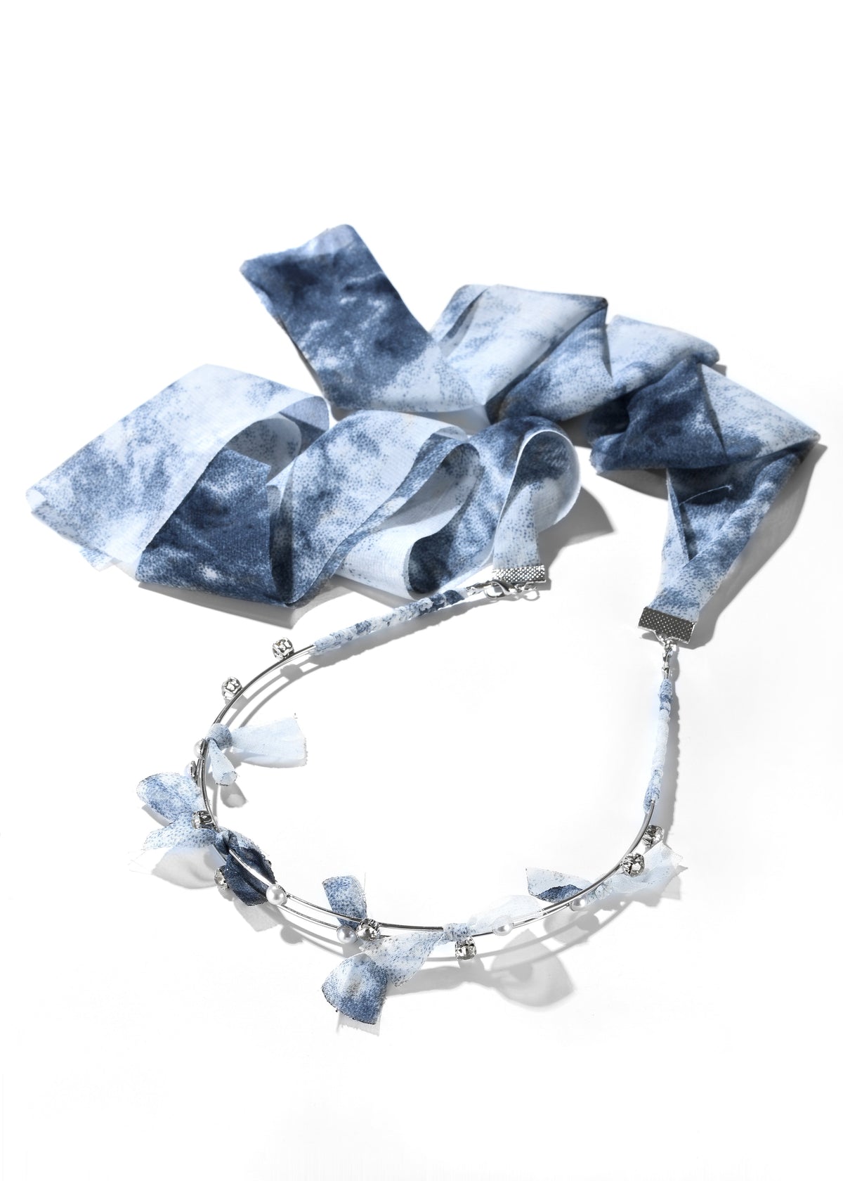 Fabric headband with a blue patterned ribbon and decorative metal band