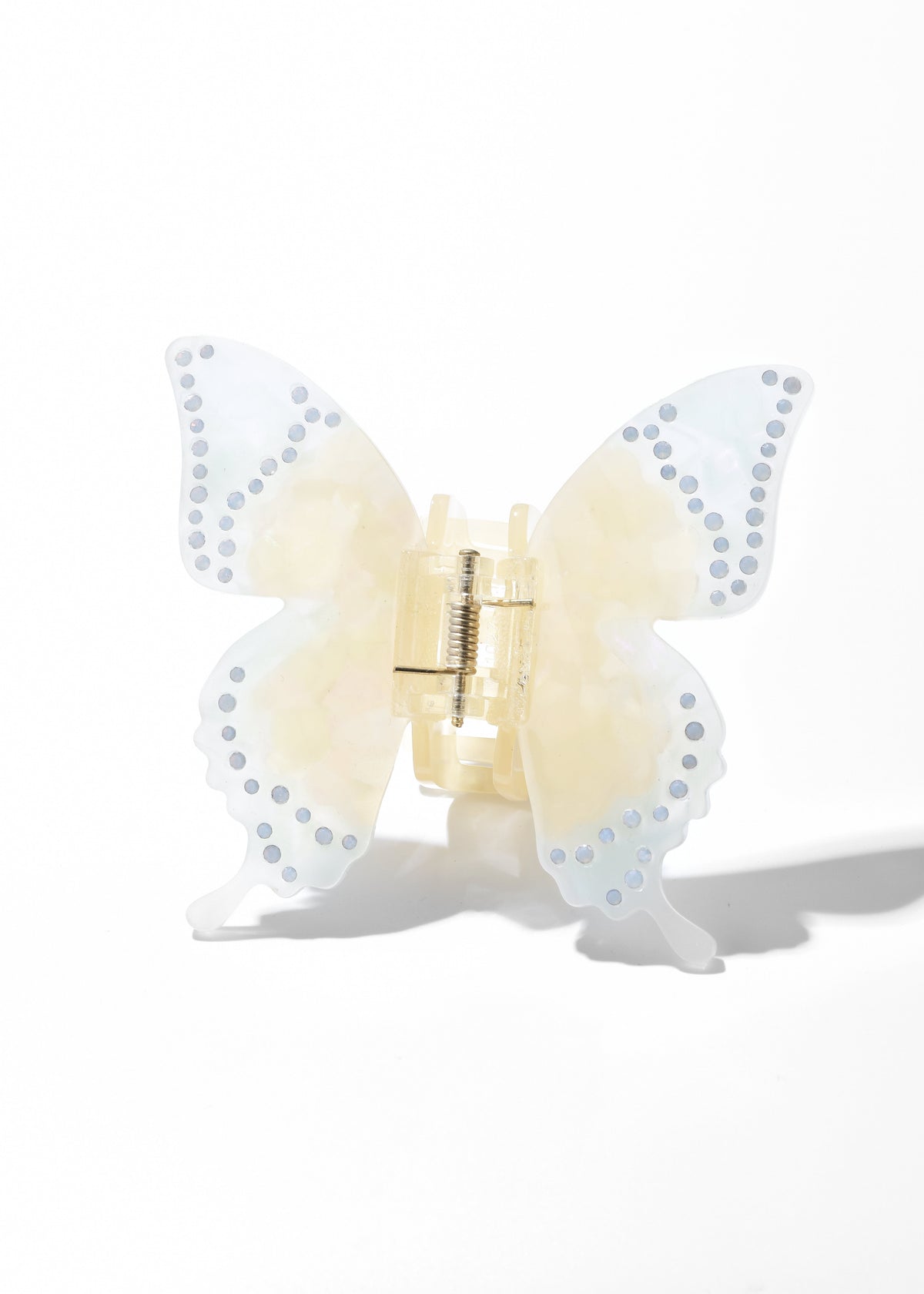Pale yellow butterfly hair clip with translucent wings and dotted edging