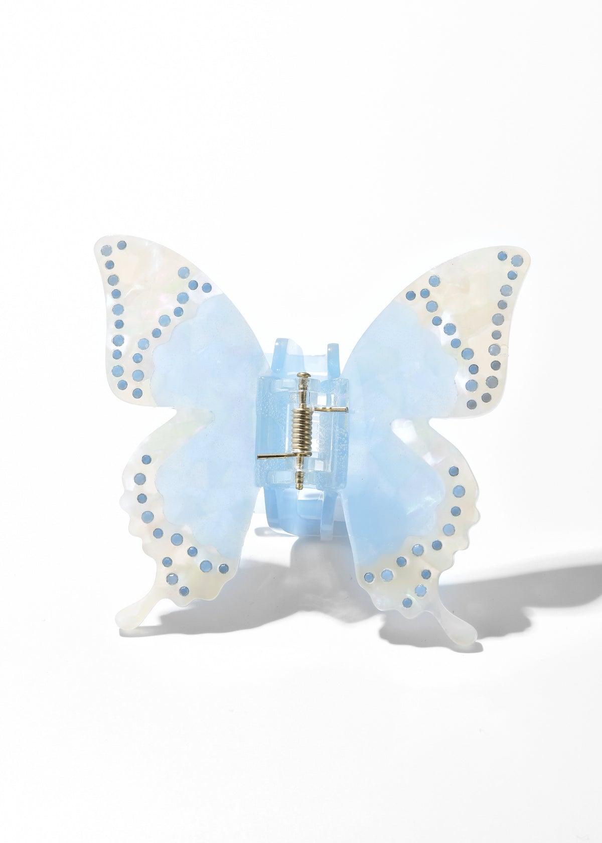 Blue butterfly hair clip with translucent wings and dotted edging