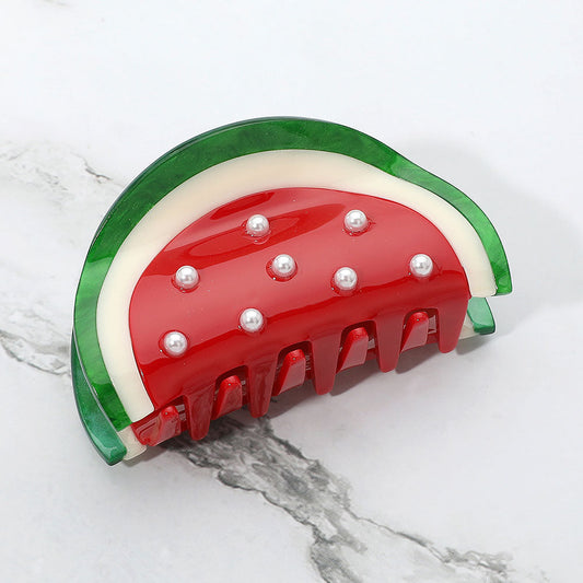 Red watermelon hair claw clip with green trim and pearl bead embellishments