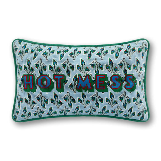Light blue needlepoint pillow with green trim and 'HOT MESS' text plus dog icons