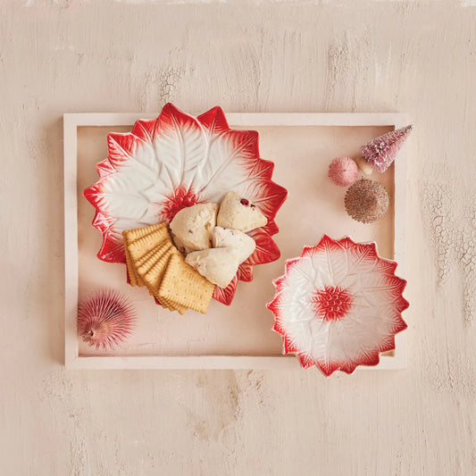 Red and white poinsettia-shaped stoneware bowl with hand-painted leaf pattern
