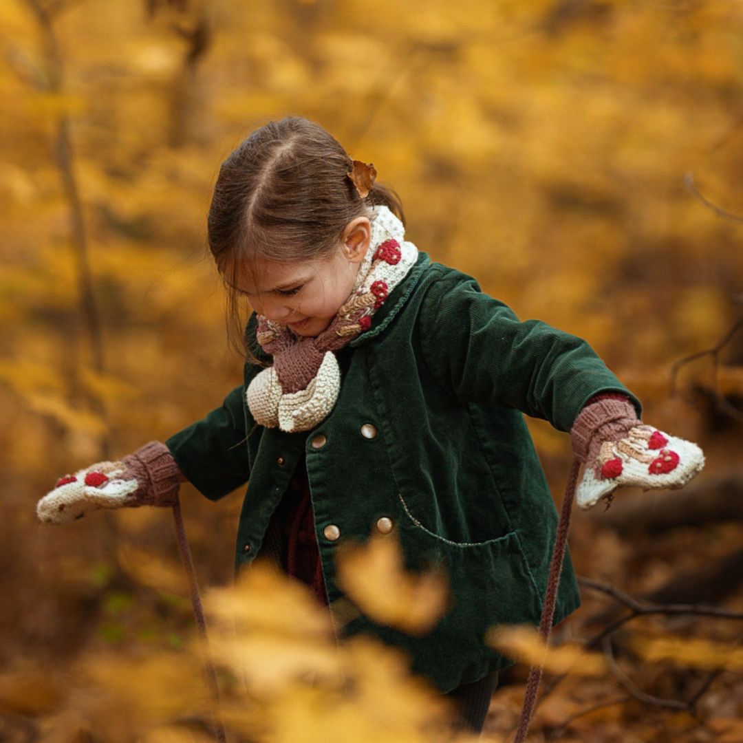 Green knit mushroom neck scarf with red caps and brown stems for kids