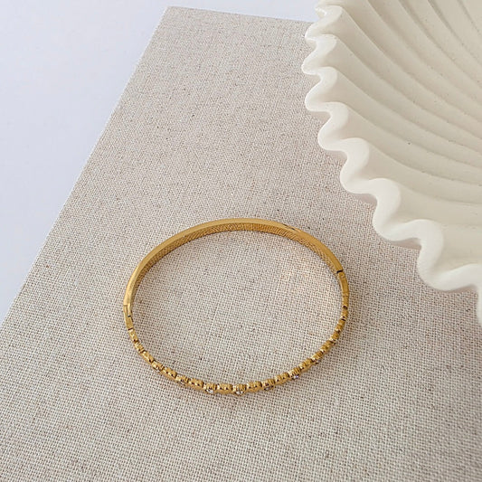 Gold heart-and-diamond hinge bracelet, hinged bangle with stone accents