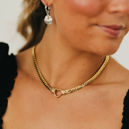 Gold-tone heart pendant necklace with twisted chain and small hoop charm links