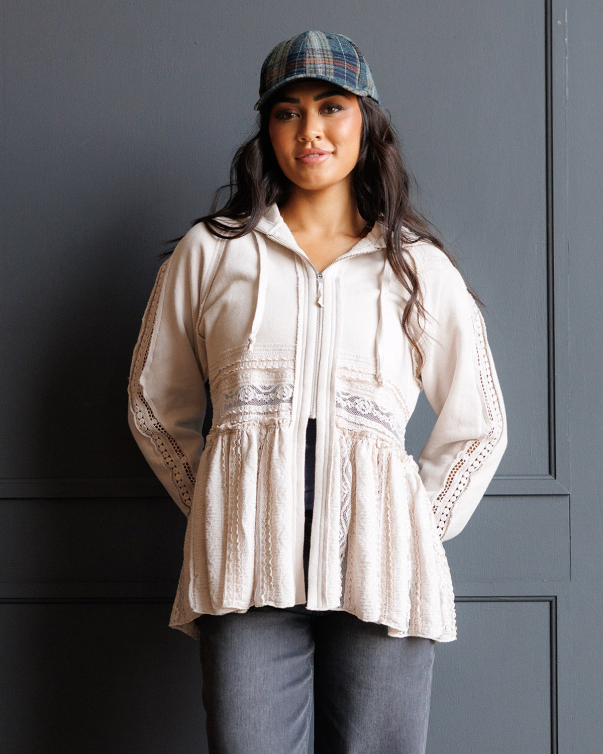 Cream lace-trim hoodie with drawstring, peplum hem, and tiered panels