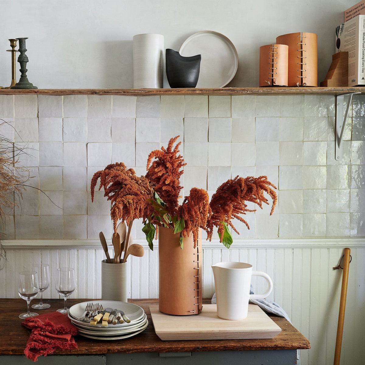 Black bird-shaped vase with hollow center, designed for floral stems