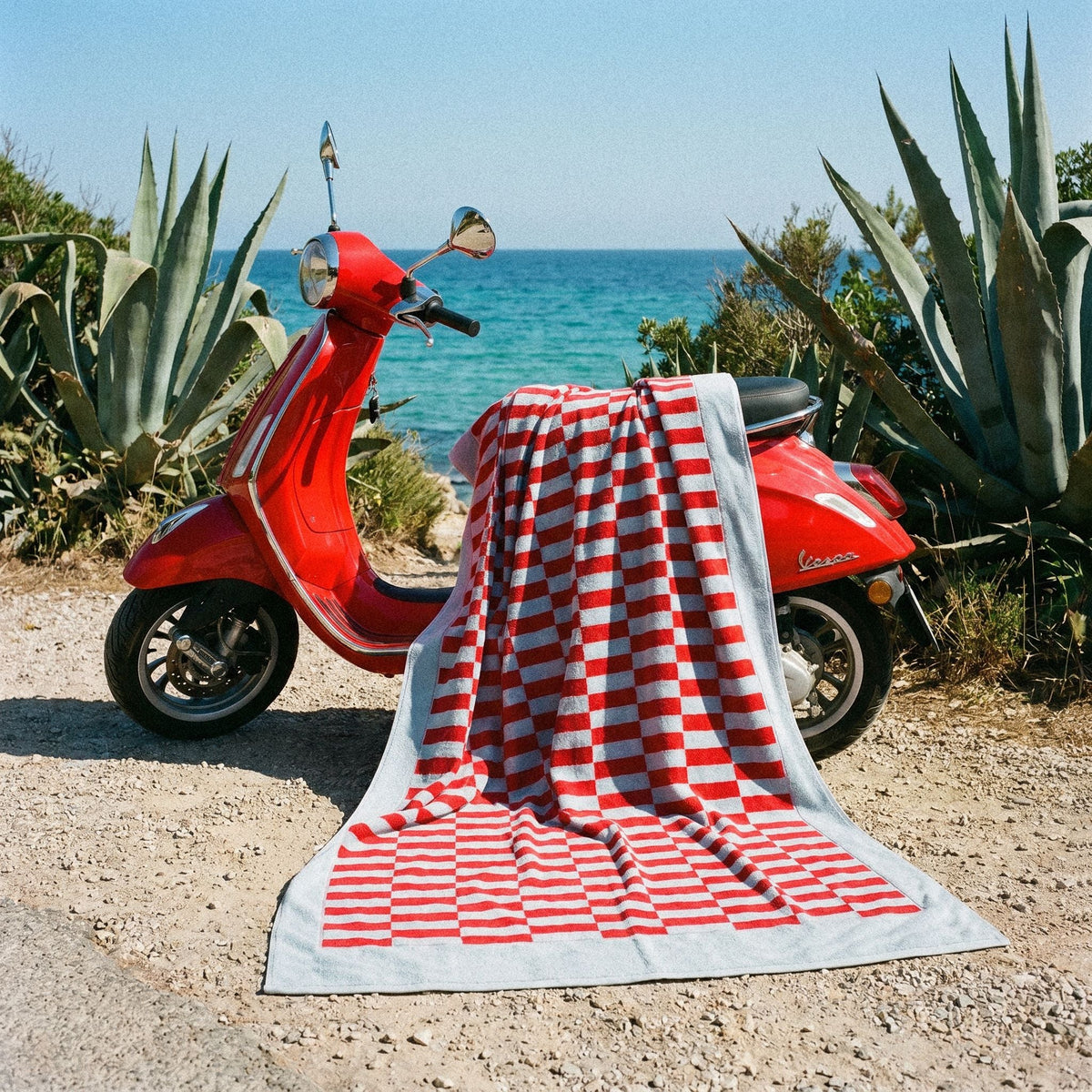 Red and white checkered cotton towel draped over a surface