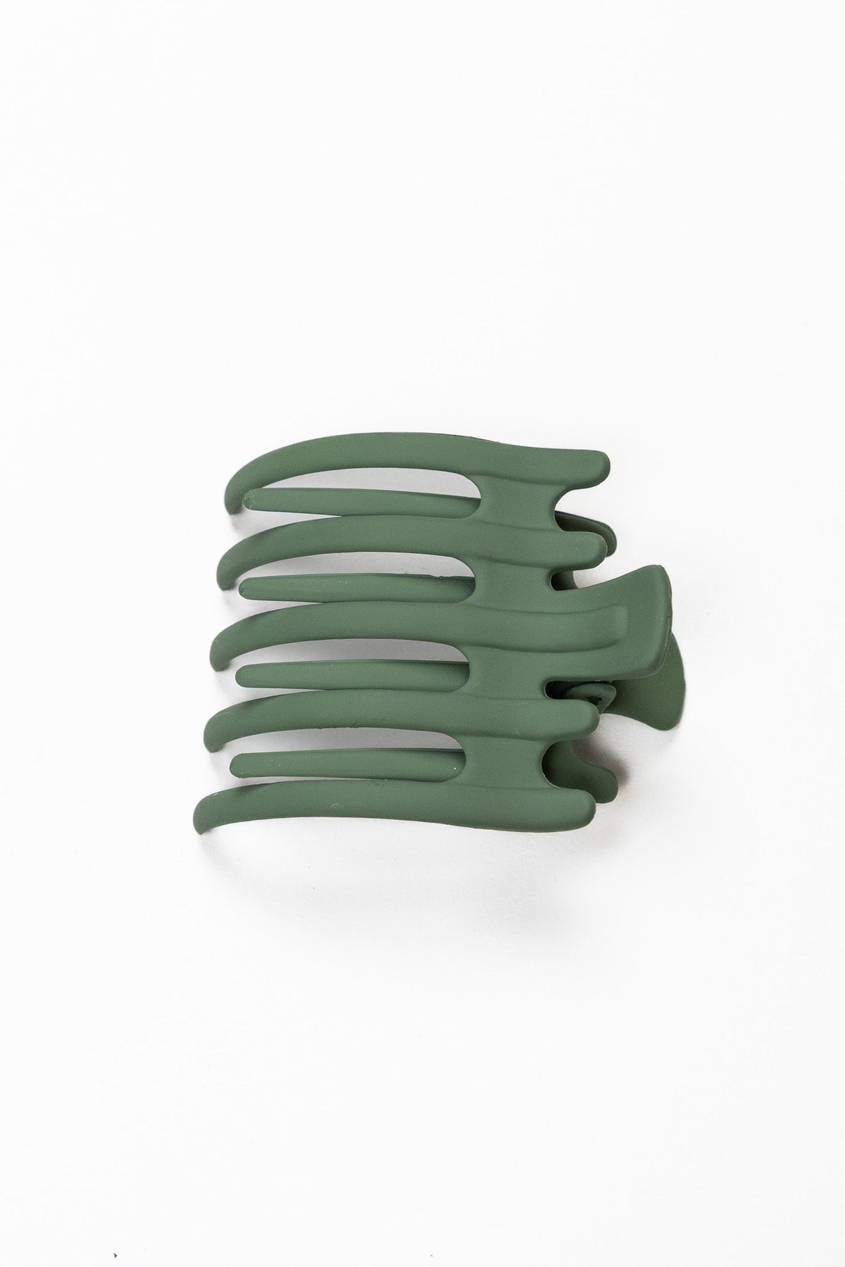 Wide hair claw clip in matte forest green, flat comb-style design
