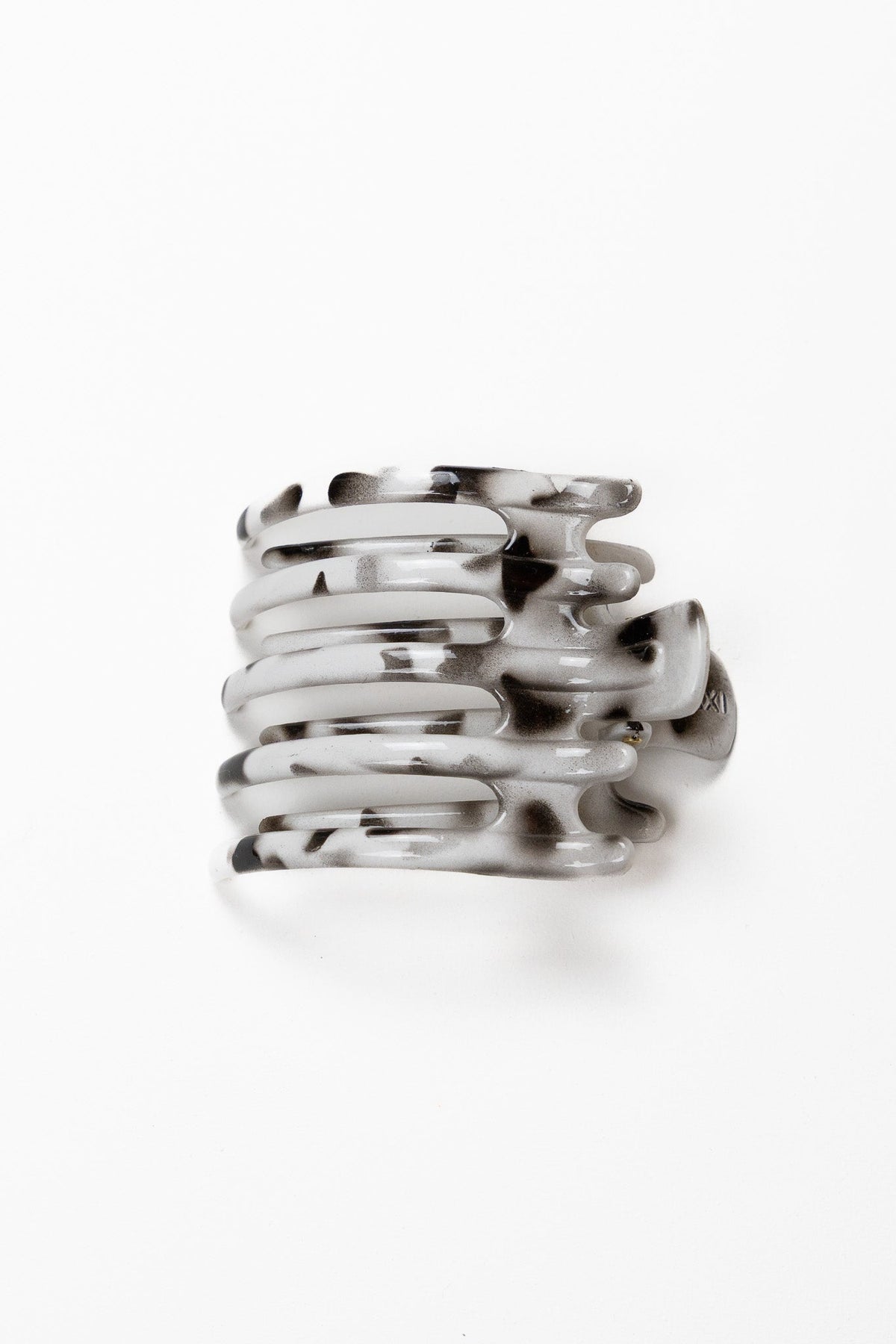 Wide hair claw clip with silver-white marbled finish