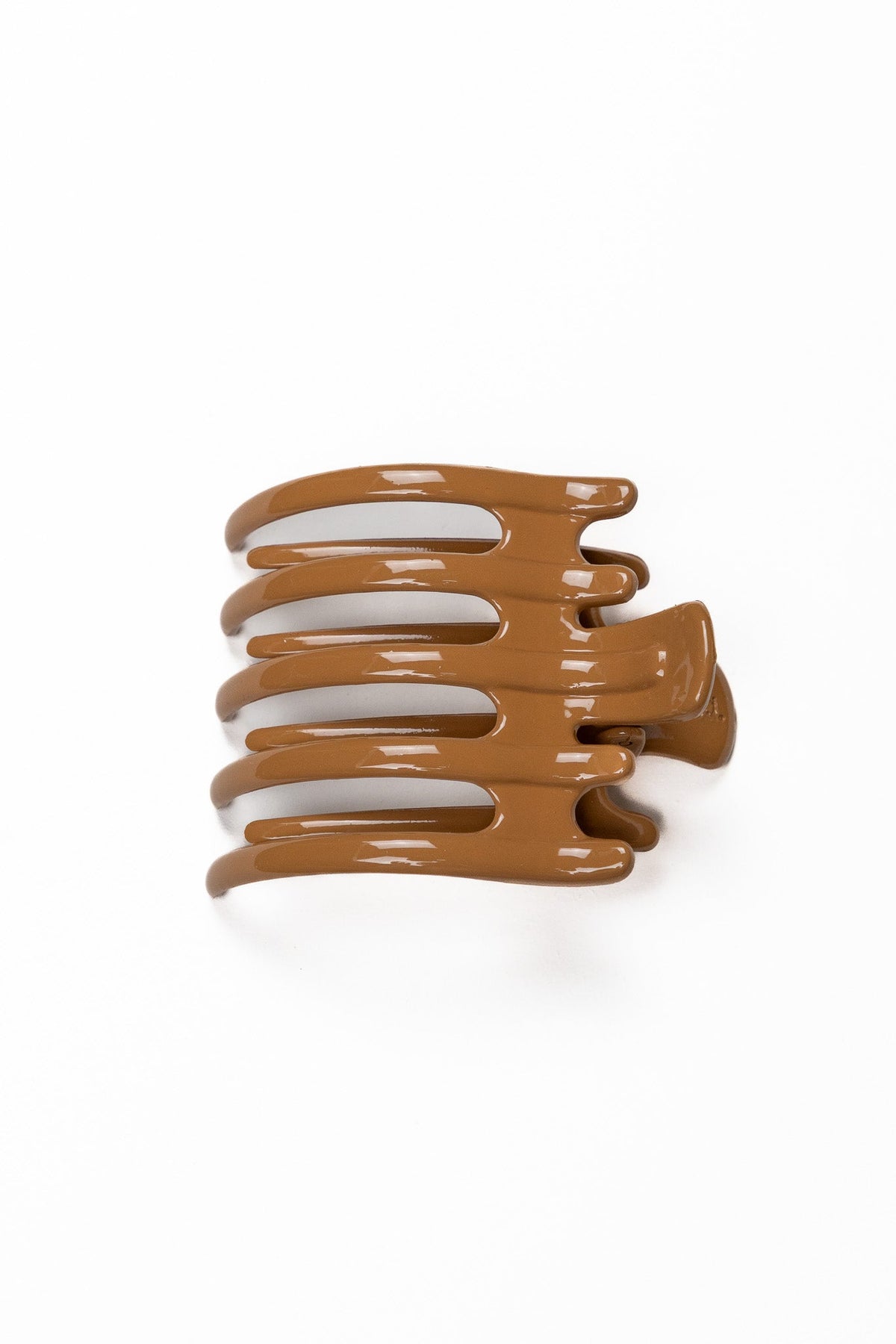Wide lay down hair claw in matte medium brown, with multiple curved teeth.