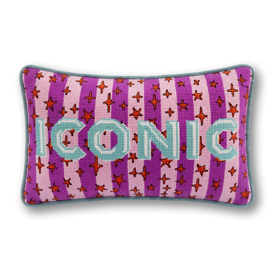 Needlepoint accent pillow with purple star-and-cross pattern and teal letter details