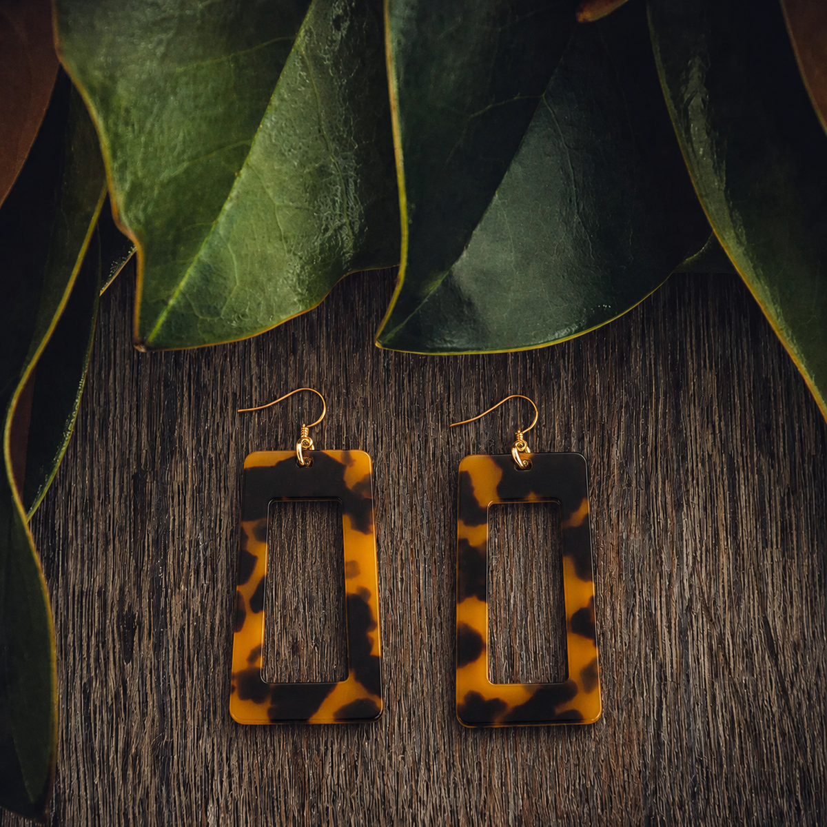 Leopard-print acrylic drop earrings with gold-tone hooks, rectangular cutout shape