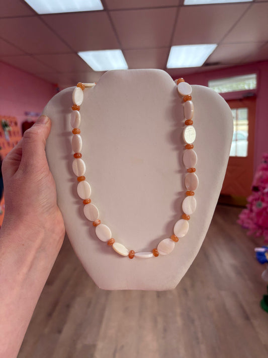 Cream and orange oval beaded necklace