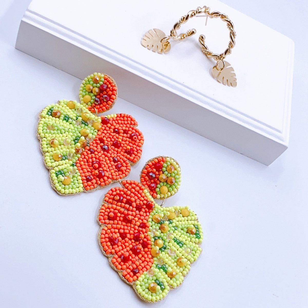 Hoja bundle of beaded heart charms in red and green with gold-tone hooks