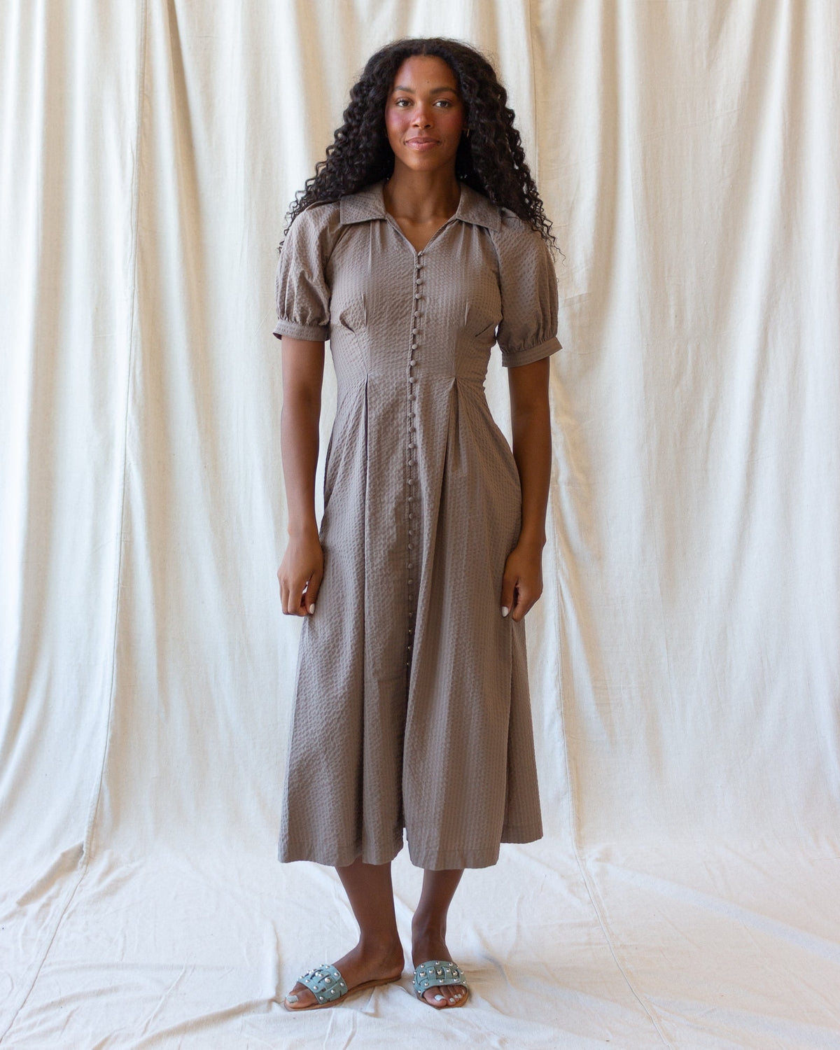Taupe/brown midi field dress with short puff sleeves and vertical button-front