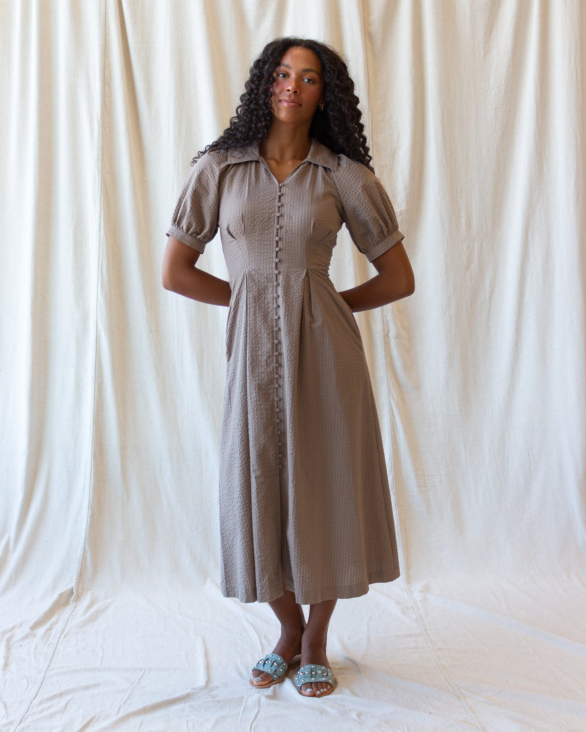Brown midi button-front field dress with short sleeves and pointed collar