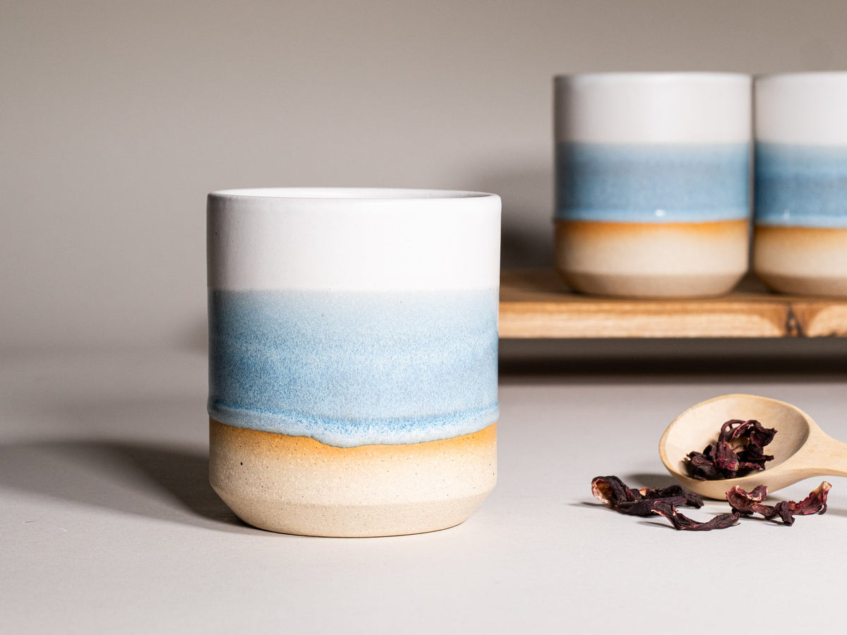 Ice blue and white stoneware smoothie cup with wide rim and ombre glaze