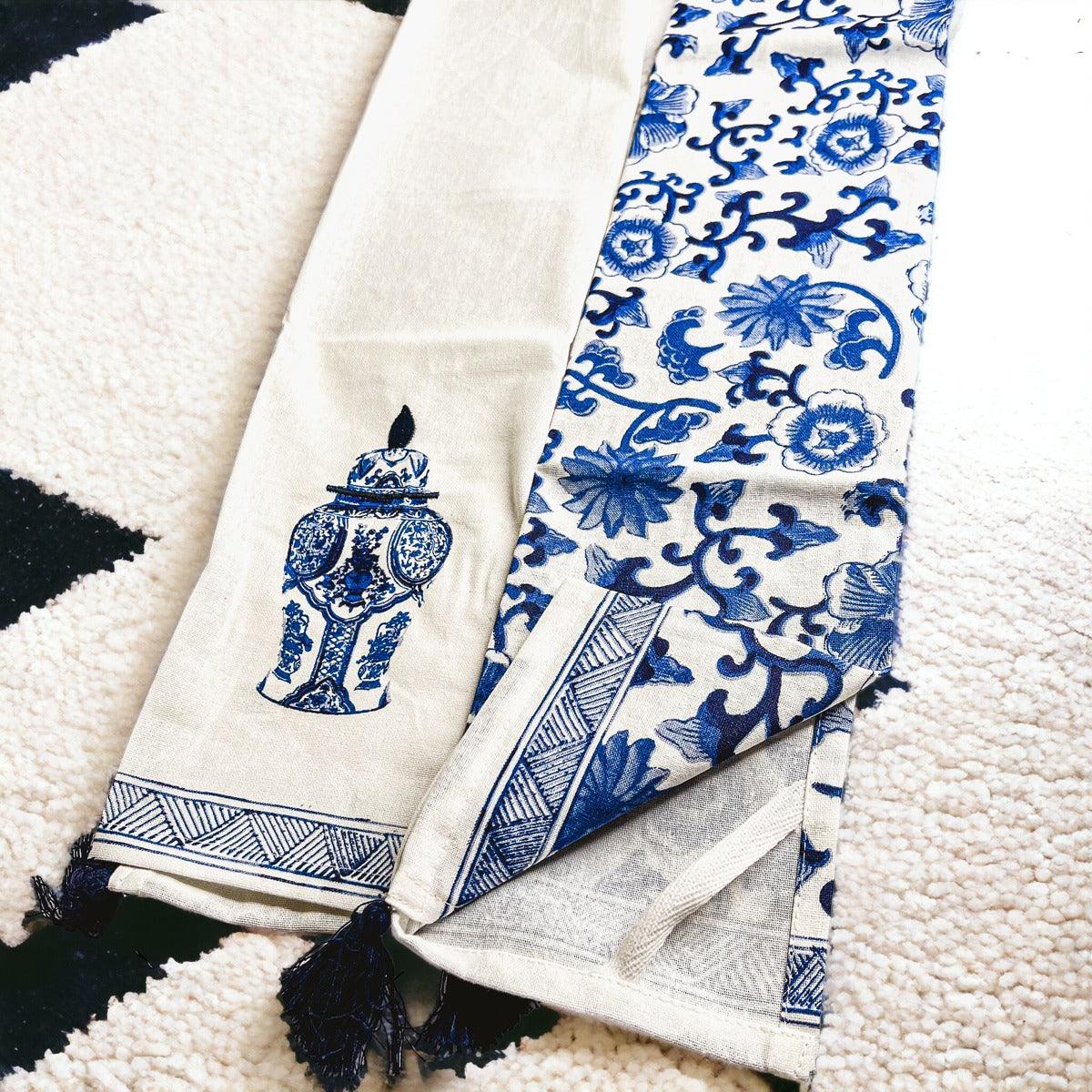 Chinoiserie tea towel with blue urn motif and striped border, tassel fringe