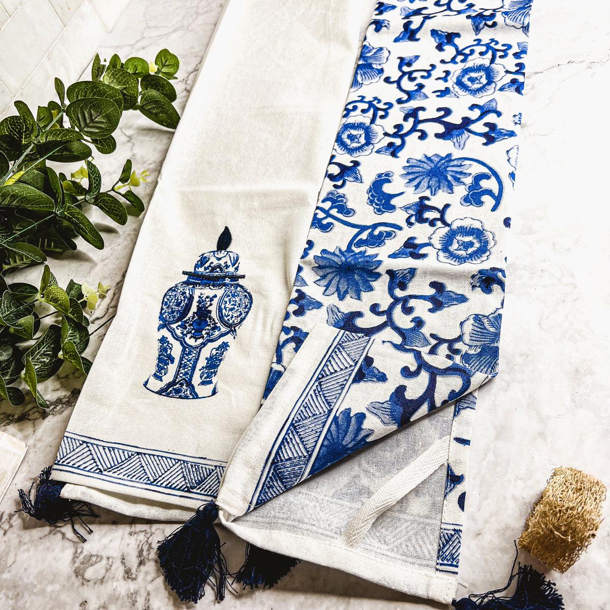 Blue-and-white chinoiserie tea towel with urn motif and striped border with tassels