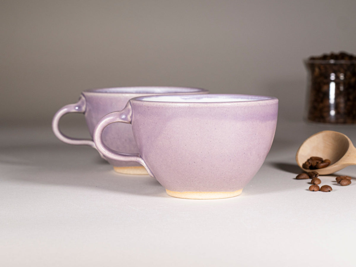 Purple stoneware latte cup with handle, smooth glossy finish and cream base glaze